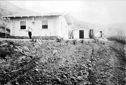 1920s photograph of an early wooden cottage on a newly graded hillside lot in La Habra Heights